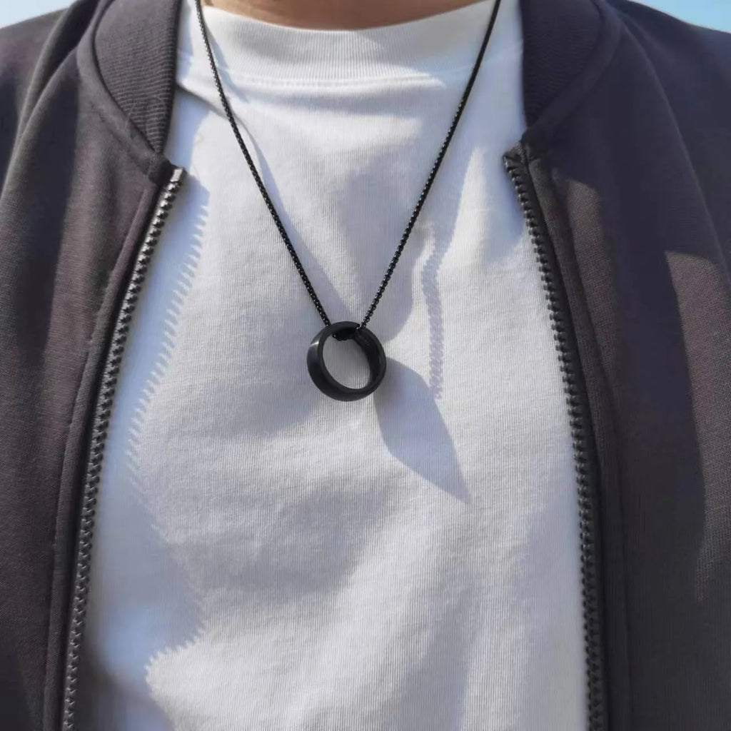 Men's silver pearl chain circle pendant necklace with stainless steel chain and titanium steel pendant on neutral background