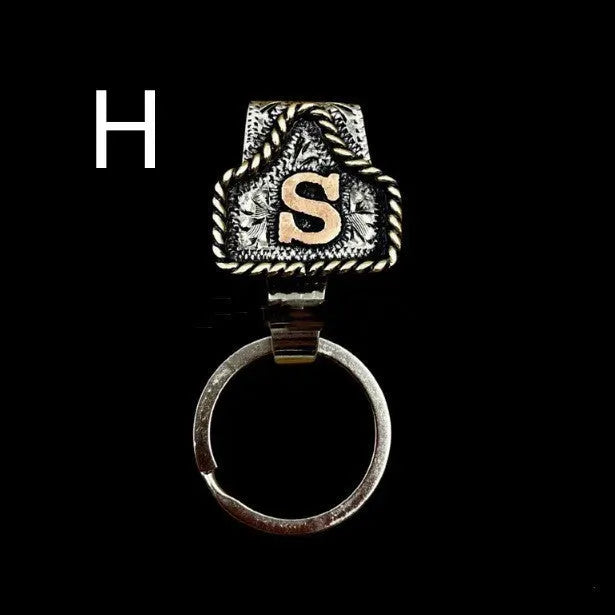 Handmade metal cow tag belt keychain in a selected colour from the A-Z letter range.