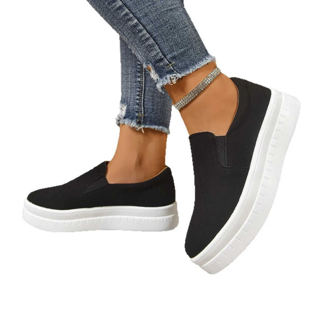 Women's round-toe thick platform sole flats in black, PU upper, elastic band, side view