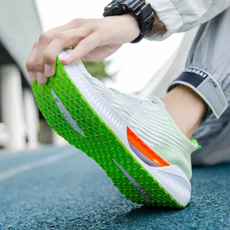 Men's blue breathable casual sports shoe with cloth upper and plastic sole on a white background.
