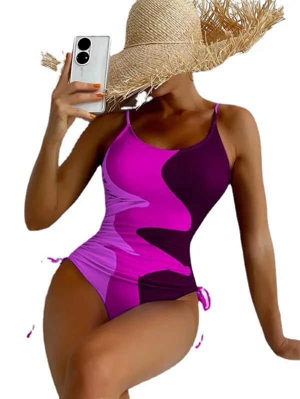 Women's blue sleeveless one-piece swimsuit with fixed trunks on a mannequin.