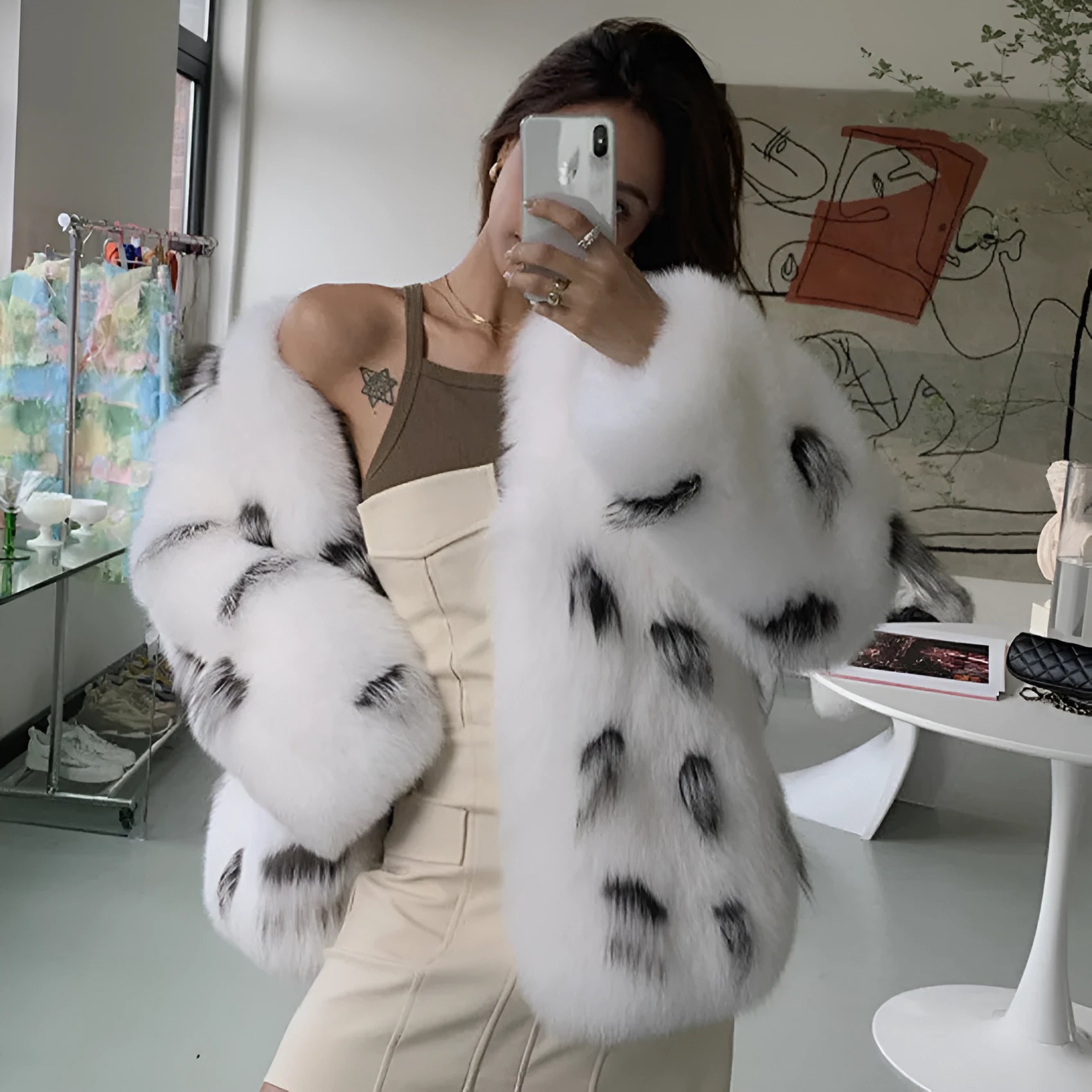 Black and white raccoon pattern faux fur coat on a model, short length, plus size.