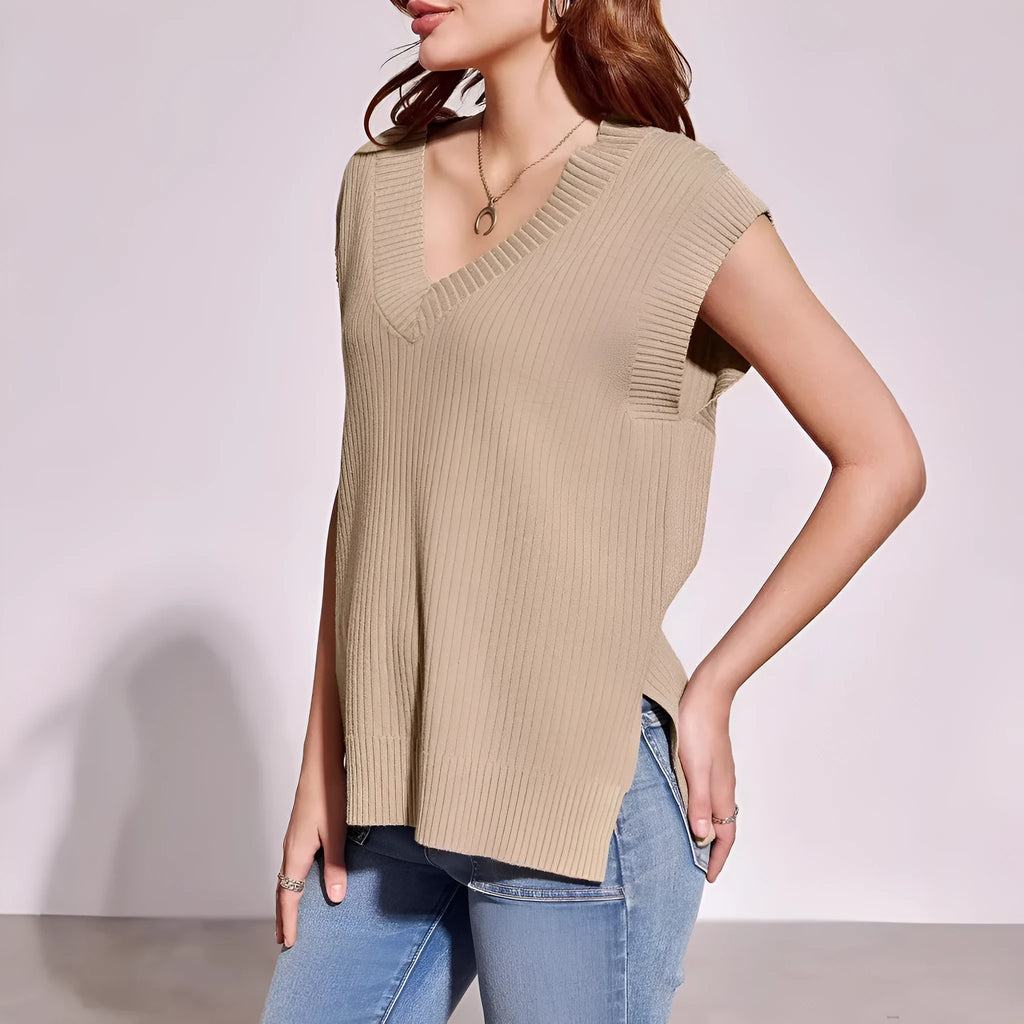 Camel and white loose v-neck sleeveless vest with striped or plaid pattern.