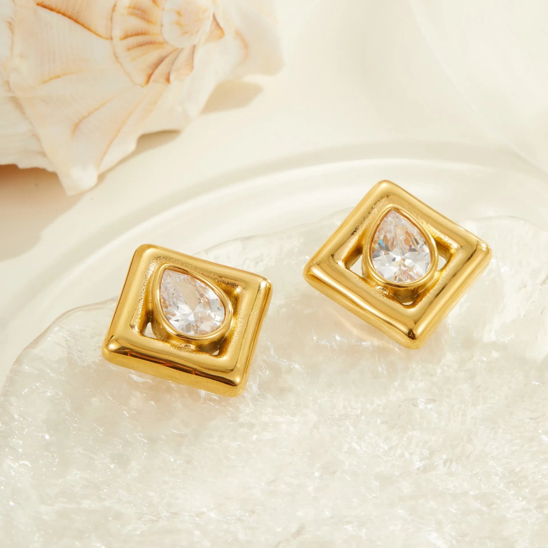 Geometric stainless steel stud earrings with water drop zircon stones in 18K gold colour