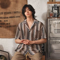 Grey Japanese style men's shirt with Cuban collar, jacquard texture, and short sleeves.