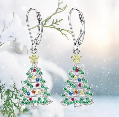 A pair of star-shaped Christmas tree earrings for women in a white gold colour.