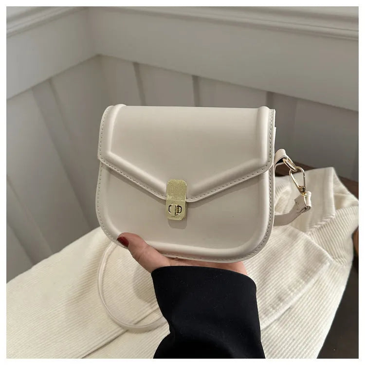 Soft PU leather clamshell messenger bag in horizontal square design shown in available colours.