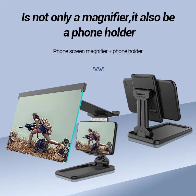 Black folding mobile phone screen magnifier with detachable phone holder on a desk.