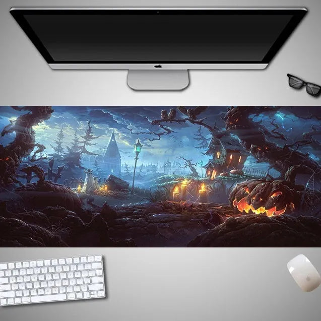 Oversized Halloween graphic cloth mouse pad on a desk, showing non-slip rubber base.