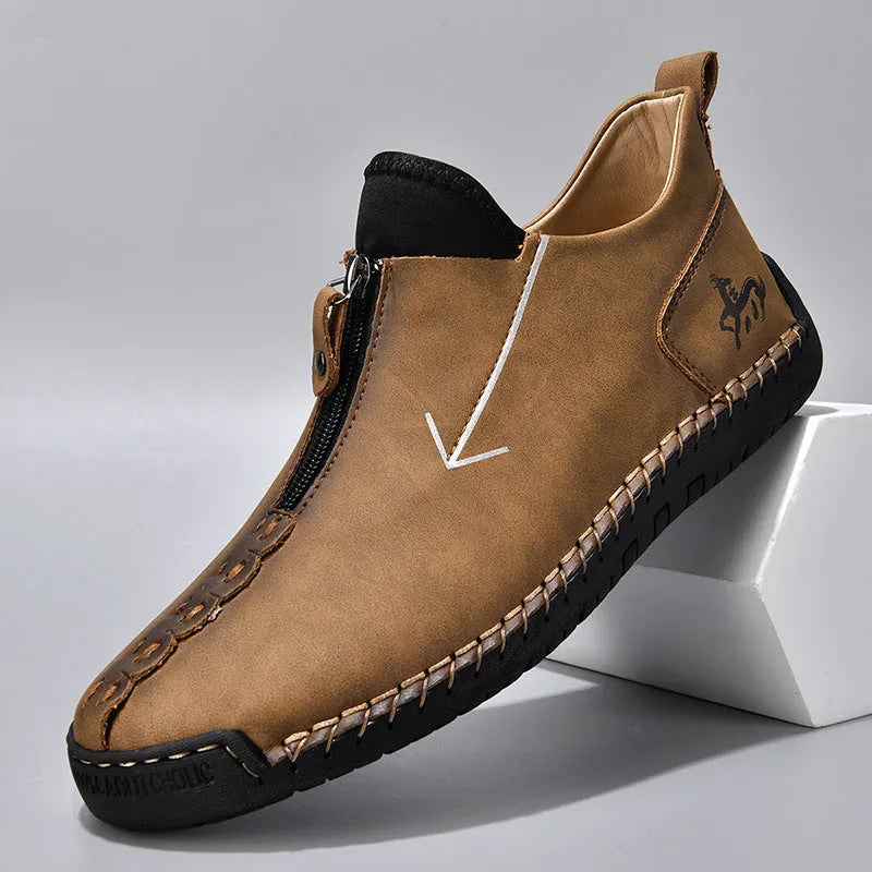 Men's black leather-look casual boot with front zipper, round toe, and mid-calf shaft.