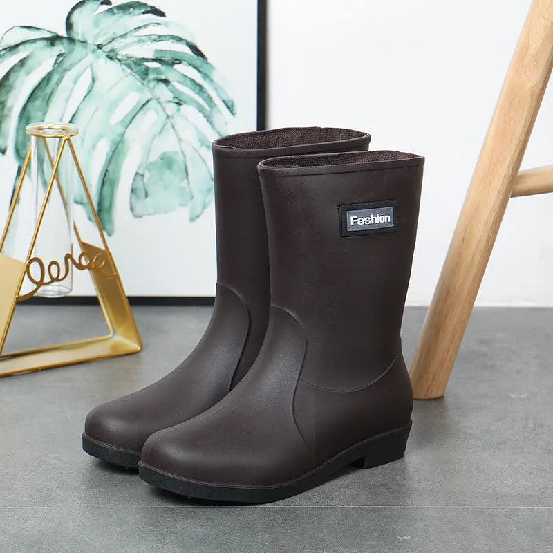 Women's mid-calf PVC rain boots in black with low heel design