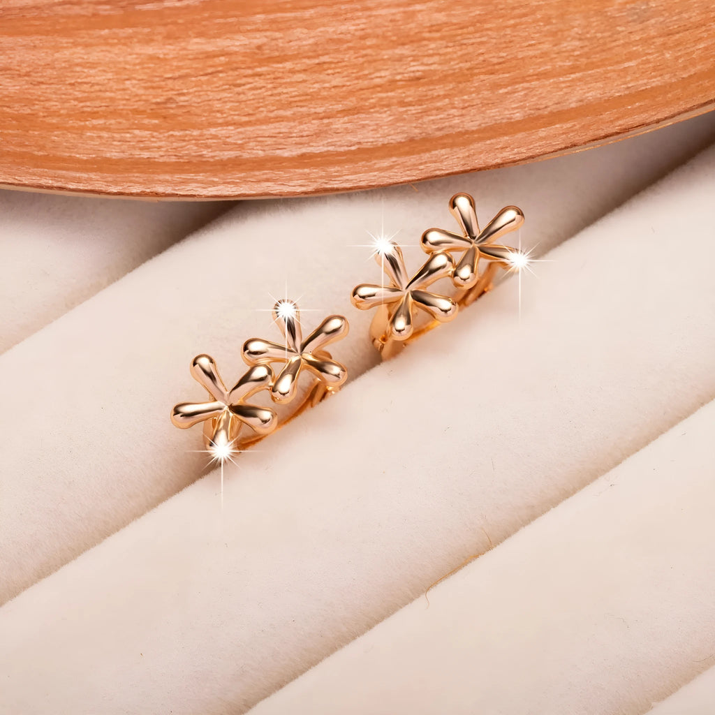 Rose gold circular earrings with a waterdrop flower design for women.