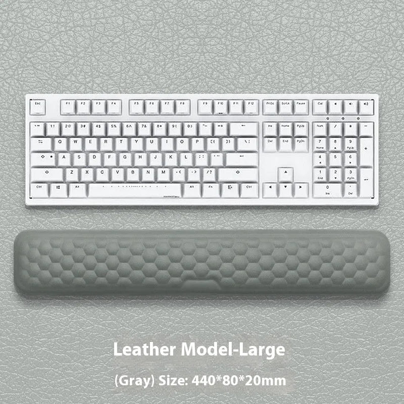Memory foam mouse wrist rest with silicone base in black cloth and grey leather style options.