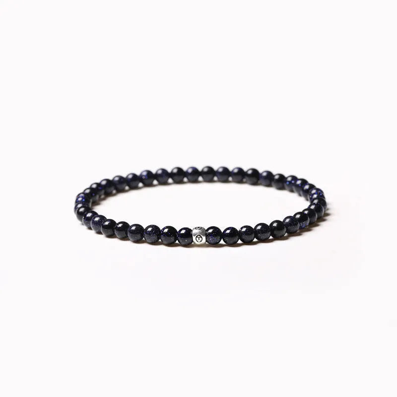 Geometric agate bracelet with obsidian, blue San, and black agate stones on wrist