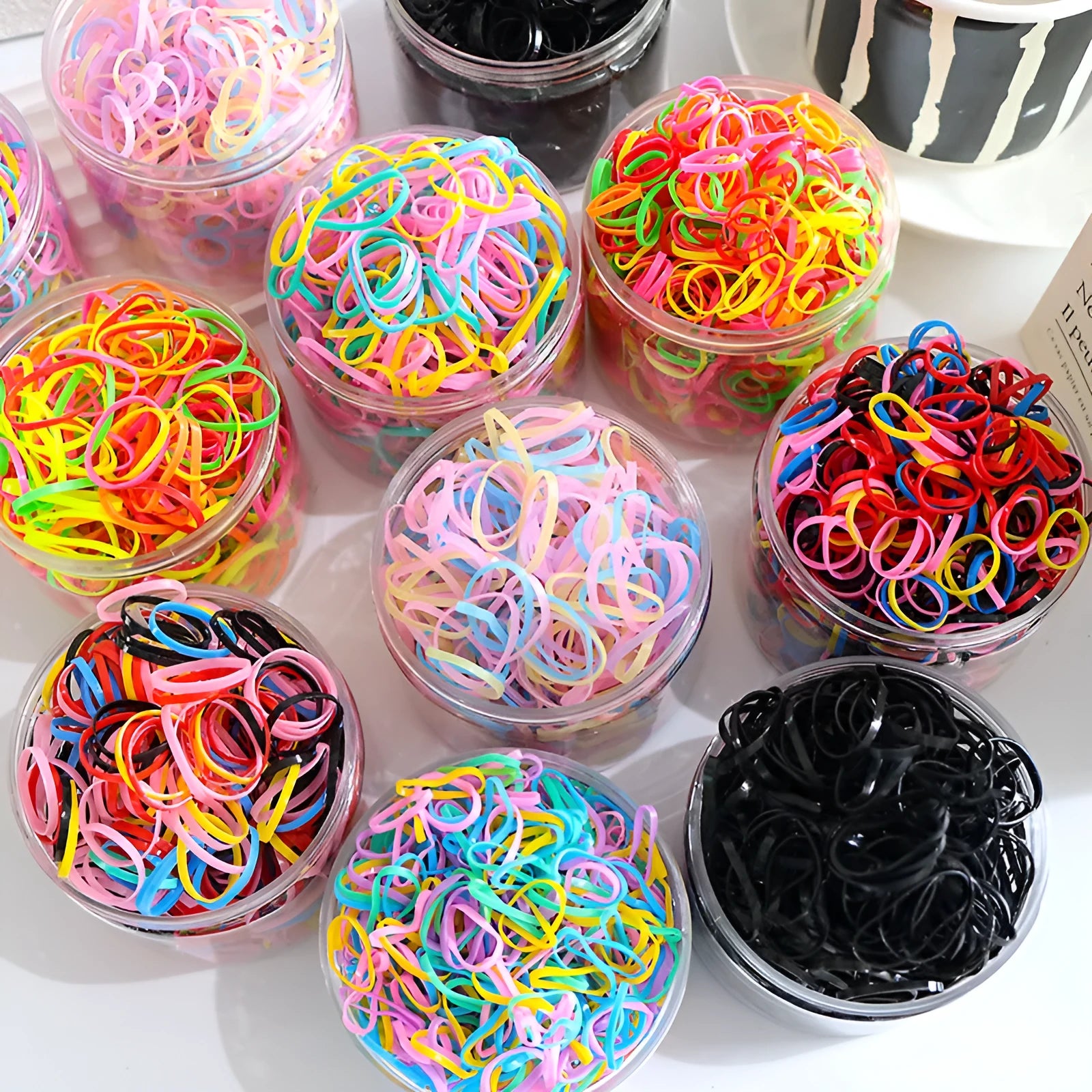 TPU elastic baby hair ties in multicolour assortment with reusable storage container