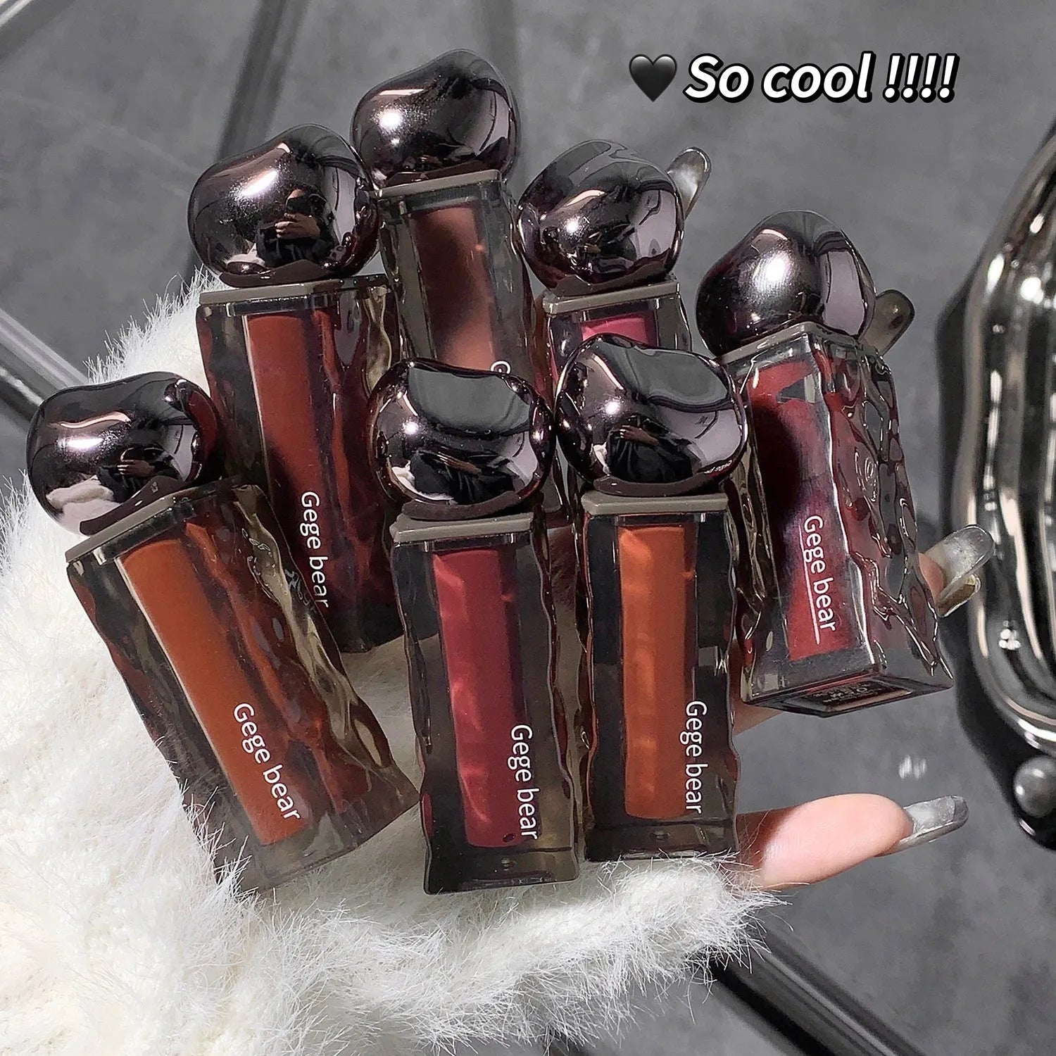 Glacier Lava Lip Lacquer tube in one of seven colour numbers for a mirror-like glossy finish.