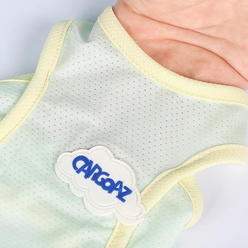 Grass green polyester cat vest for summer wear in size medium on grey background