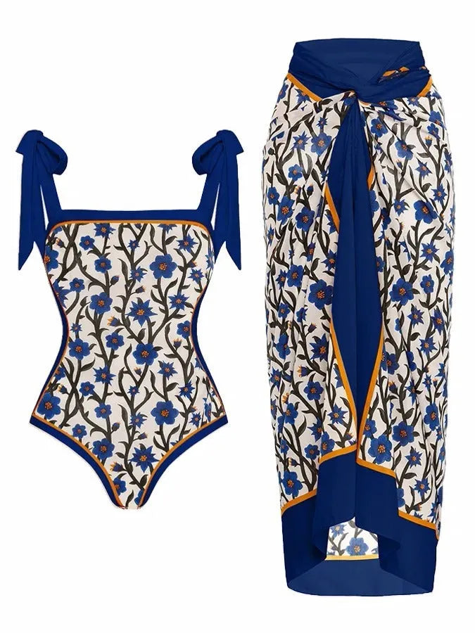 Women's floral print two-piece swimsuit with a sheer chiffon hip skirt, shown in one of the available colour variations.