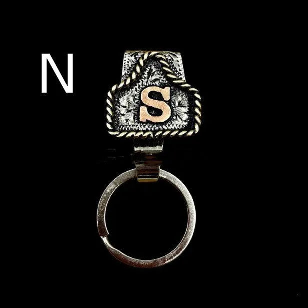 Handmade metal cow tag belt keychain in a selected colour from the A-Z letter range.