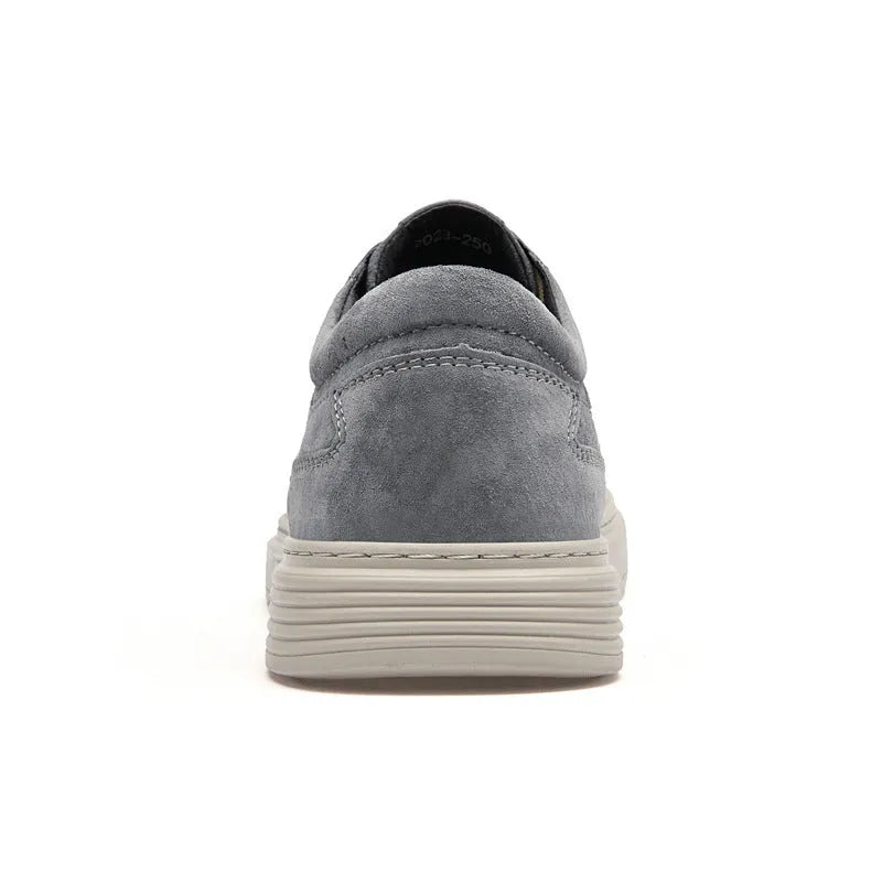 Men's grey pigskin leather casual skate shoes with flat rubber sole and lace-up front.