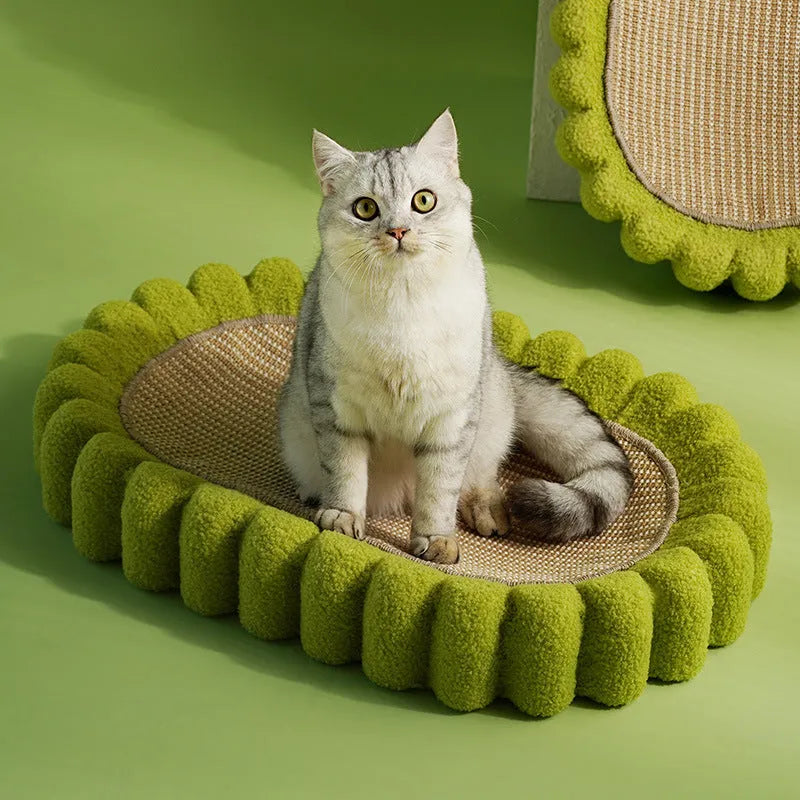 Green oval sisal cat scratching pad that also serves as a cat bed.