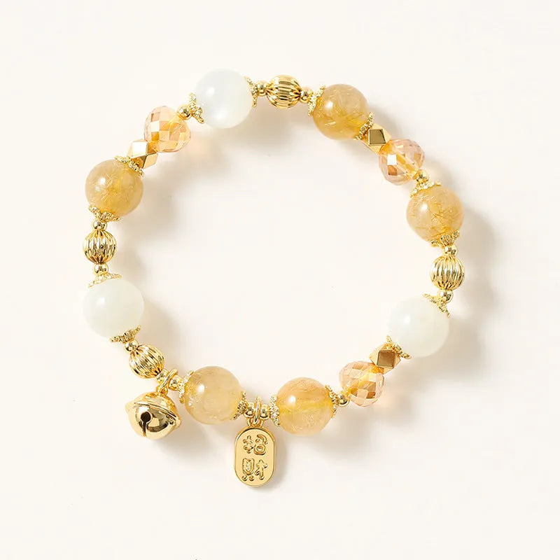 Gold tone rutilated quartz bracelet with electroplated finish and Korean style design