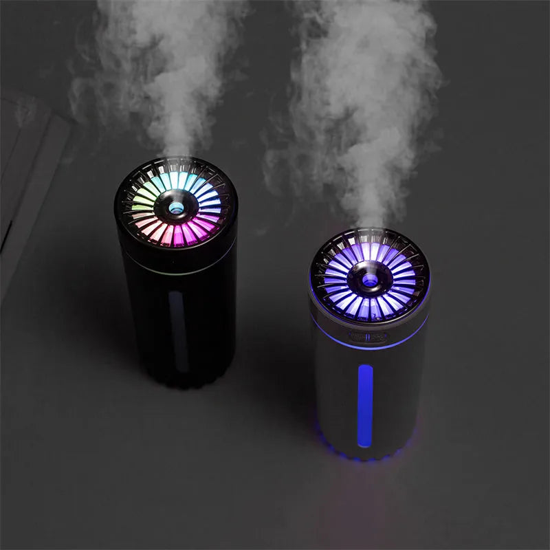 Black and white portable USB rechargeable humidifier with colourful lights for car and desktop use.