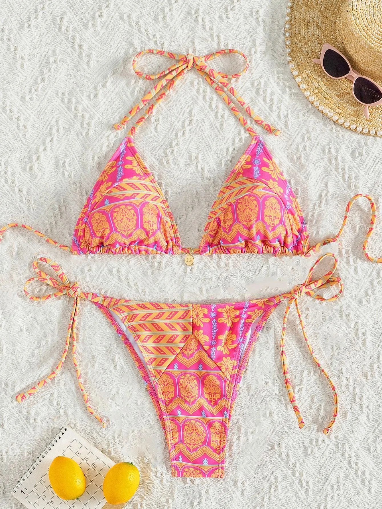 Women's split bikini swimsuit with bandage stitching in polyester material