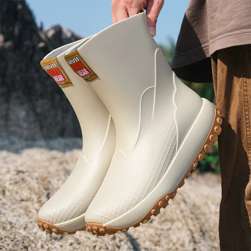 Men's mid tube PVC rain boots in black with non-slip plastic sole, round toe, flat heel
