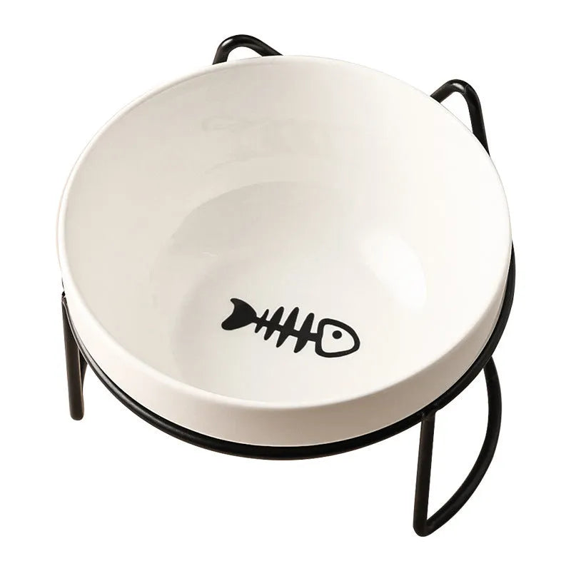 White ceramic cat bowl with cat paw print design on a black iron frame stand
