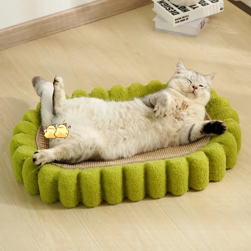 Green oval sisal cat scratching pad that also serves as a cat bed.