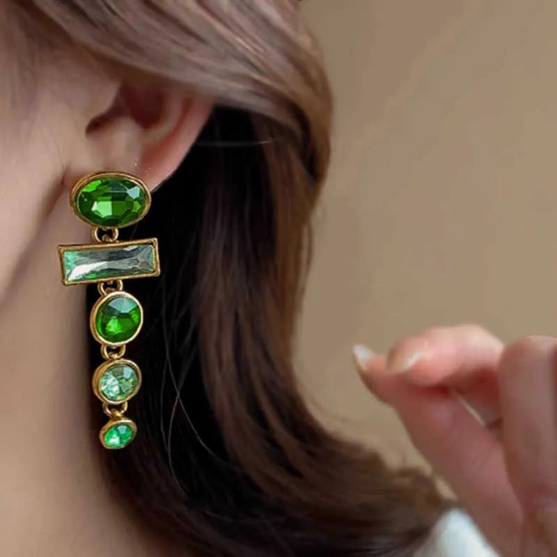A pair of geometric Chinese style alloy earrings with a retro green gradient finish and zircon-inlaid tassels.