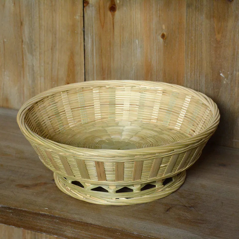 Three handmade bamboo storage baskets in different sizes including one with deepening design