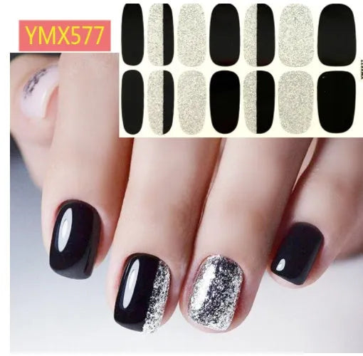 Full nail stickers set of 14 sheets showing 16 colour options in a flat lay arrangement