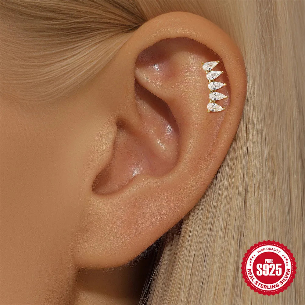 S925 sterling silver geometric star-shaped earrings with an embedded moon diamond, shown in a gold colour finish.