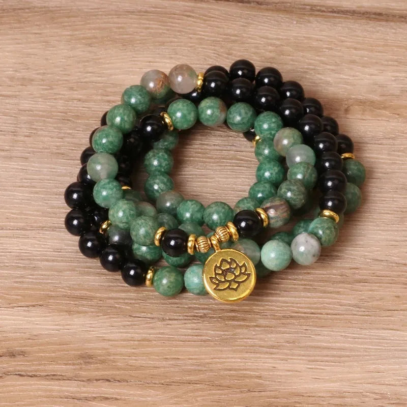 Green and black elastic beaded fashion bracelet with alloy clasp showing adjustable design
