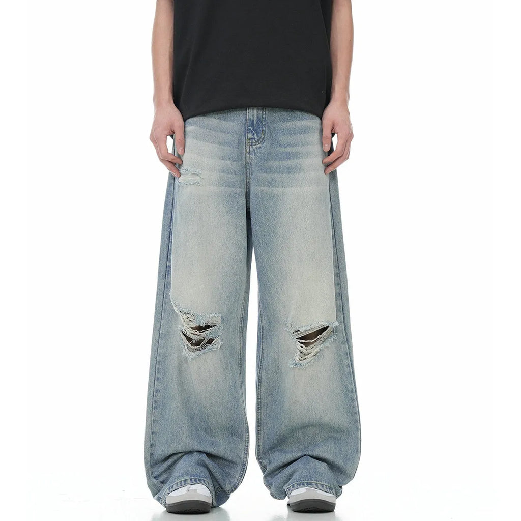 Blue men's straight-leg ripped jeans with a cotton blend fabric and zipper fly.