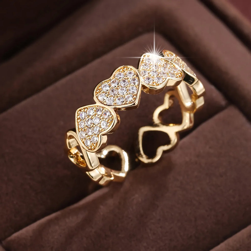 Adjustable opening copper ring with love heart geometry design in gold or silver finish.