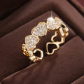Adjustable opening copper ring with love heart geometry design in gold or silver finish.