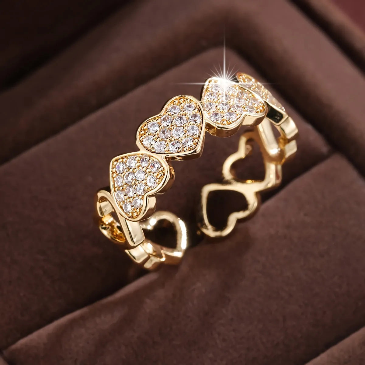 Adjustable opening copper ring with love heart geometry design in gold or silver finish.