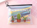 Set of 20 black 0.5mm ballpoint pens with cartoon cactus designs in plastic storage case measuring 21cm by 17cm