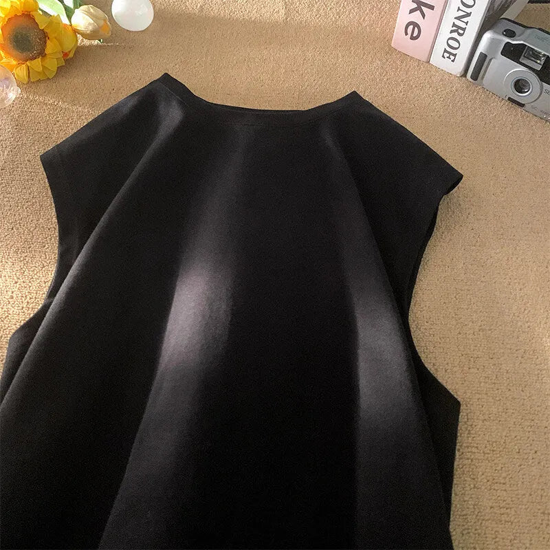 Men's loose-fitting solid colour cotton tank top on a hanger, shown in a light colour.
