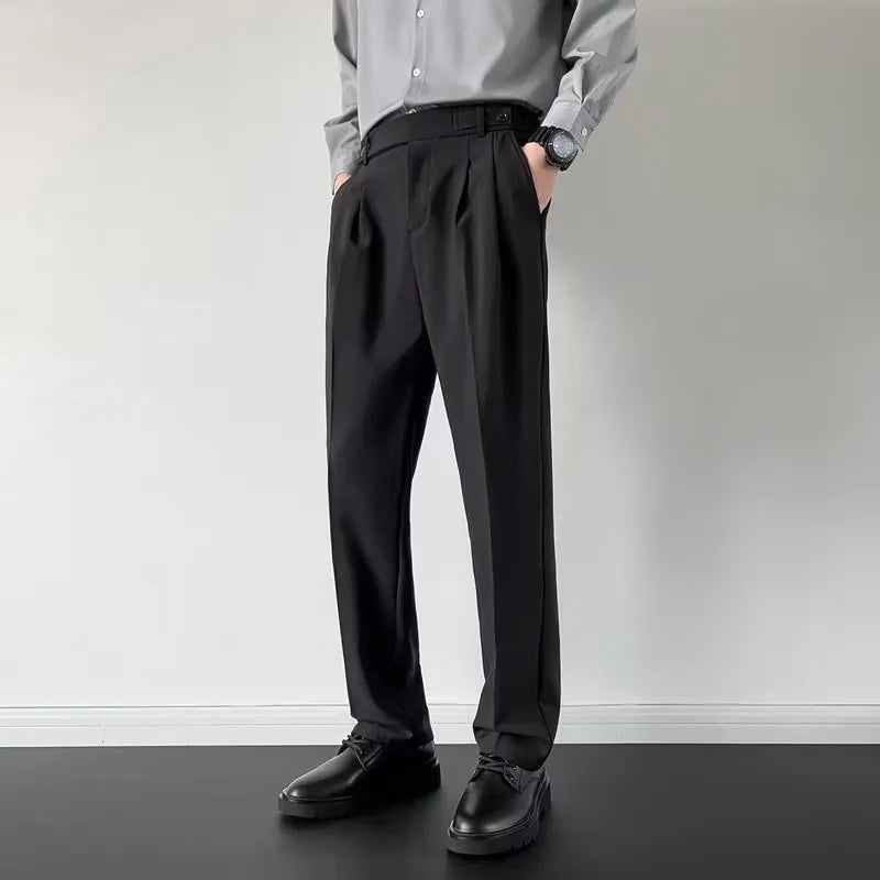 Men's apricot and black straight-leg loose fit suit trousers on a hanger