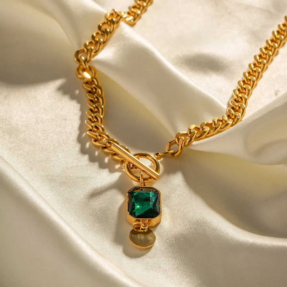 Gold electroplated titanium steel pendant necklace with French retro geometric design and emerald zircon accents