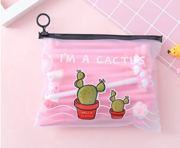 Set of 20 black 0.5mm ballpoint pens with cartoon cactus designs in plastic storage case measuring 21cm by 17cm