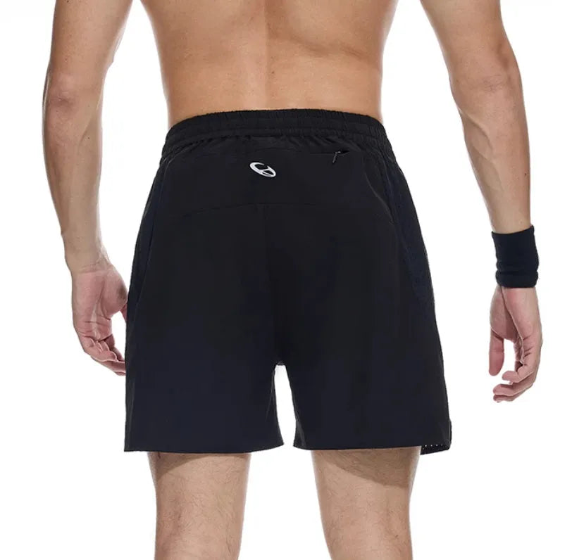 Men's black running shorts with laser stitching on a grey background, showing stretch fabric.