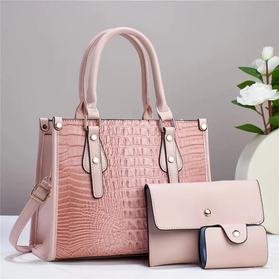 PU leather three-piece bag set showing bucket crossbody bag, wallet and card holder with contrast trim in burgundy colour