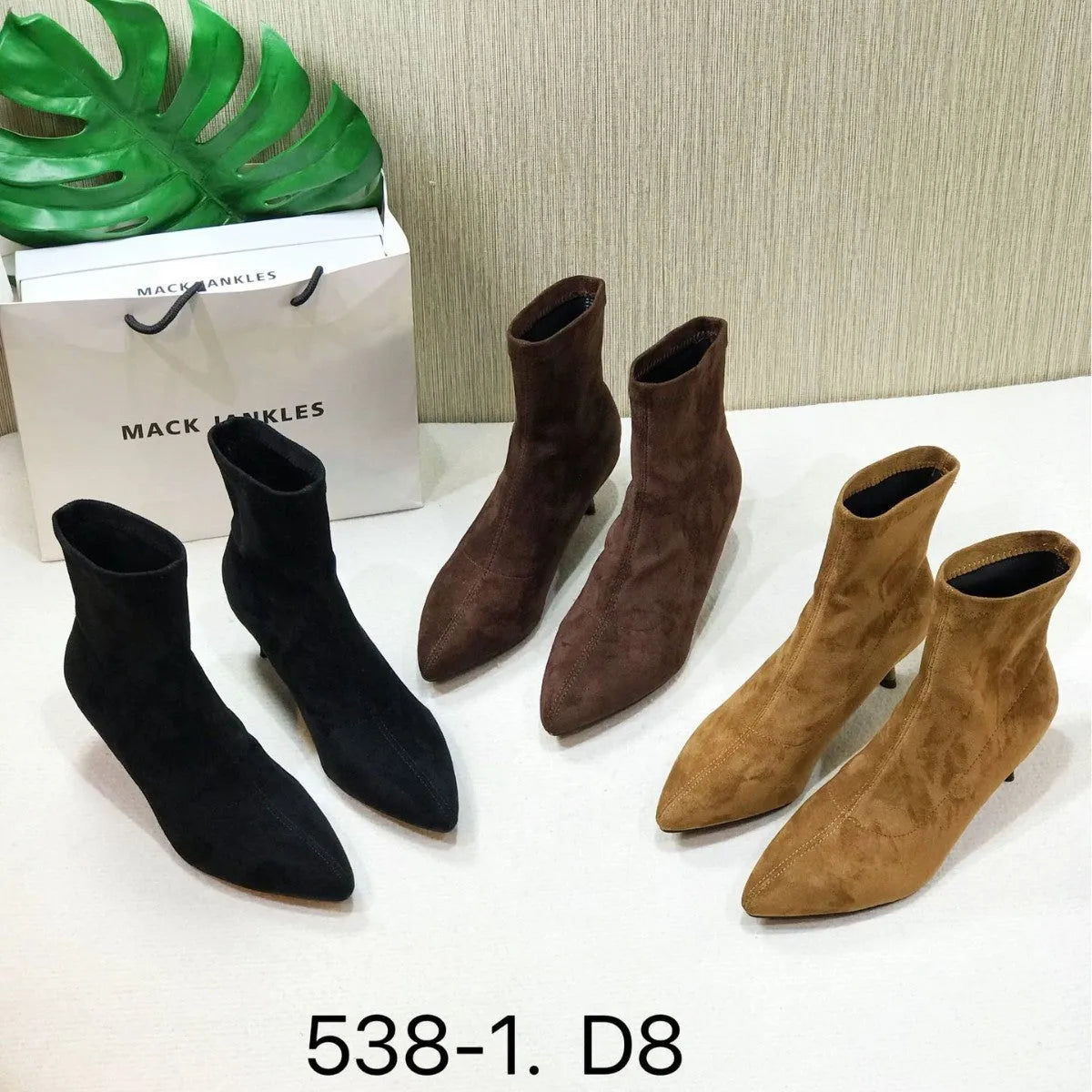 Black pointed toe women's ankle boots with stiletto heel and mid-calf height