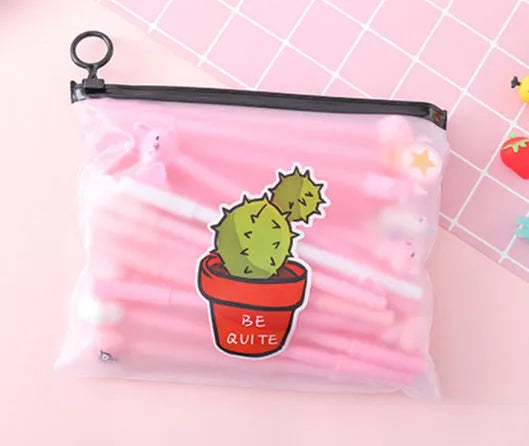 Set of 20 black 0.5mm ballpoint pens with cartoon cactus designs in plastic storage case measuring 21cm by 17cm