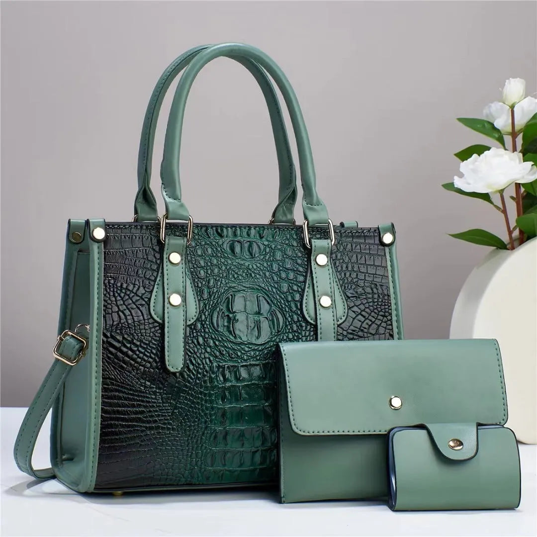 PU leather three-piece bag set showing bucket crossbody bag, wallet and card holder with contrast trim in burgundy colour